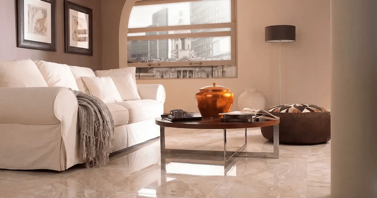 Modern living room with professionally installed marble flooring, a beige sofa, coffee table in Atlanta, GA